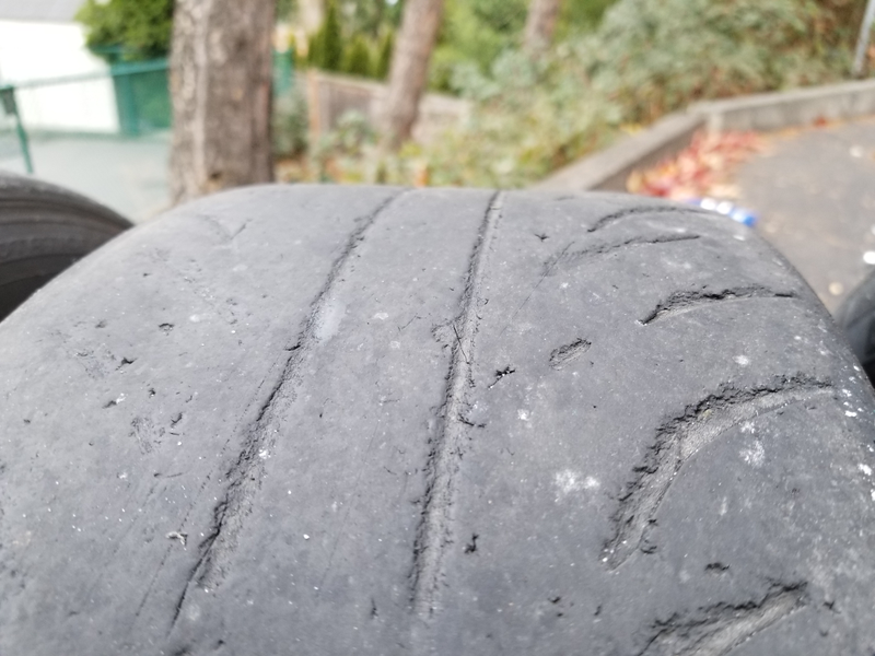 Rear driver side. Almost slicks, gouges from rallyx style driving on forest service roads, and increased wear on the inside. And yet it still grips hard even in the 6° below freezing drive to work every morning.